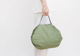 Shupatto sustainable pleated bag forest green