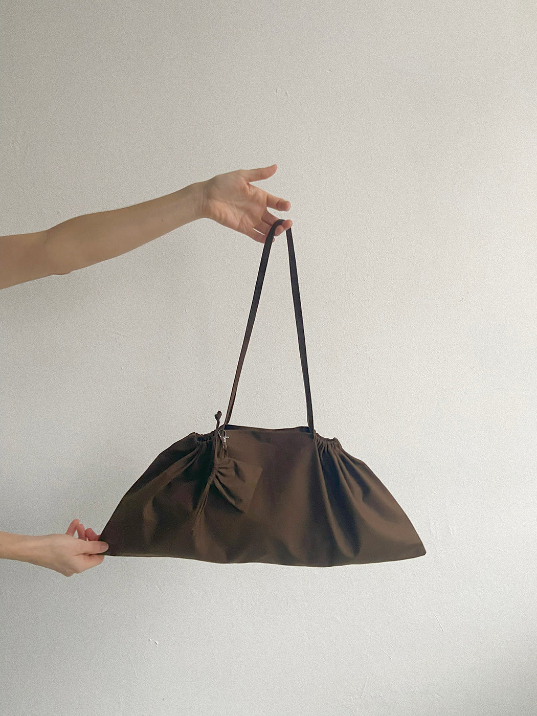 A TOTEM OF 1.2 baguette bag en 1.5 bag charm