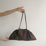 A TOTEM OF 1.2 baguette bag en 1.5 bag charm